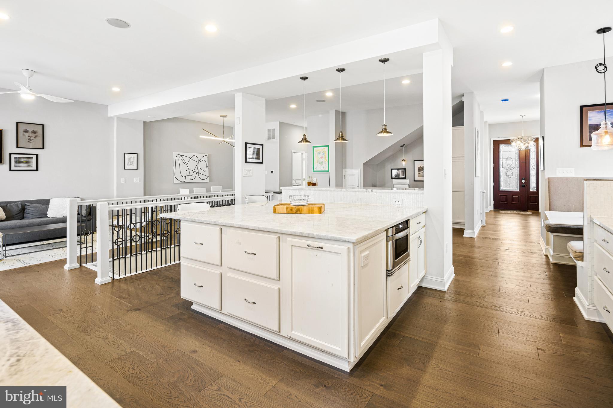 3313 Baring Street Philadelphia, PA 19104 - Photo 19 of 55 a kitchen that has a lot of cabinets in it and wooden floors