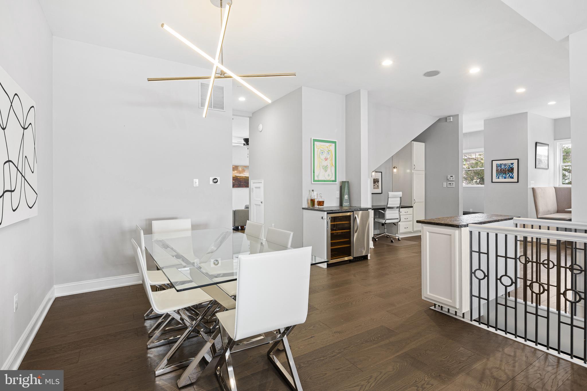 3313 Baring Street Philadelphia, PA 19104 - Photo 22 of 55 a living room with furniture and a dining table with wooden floor