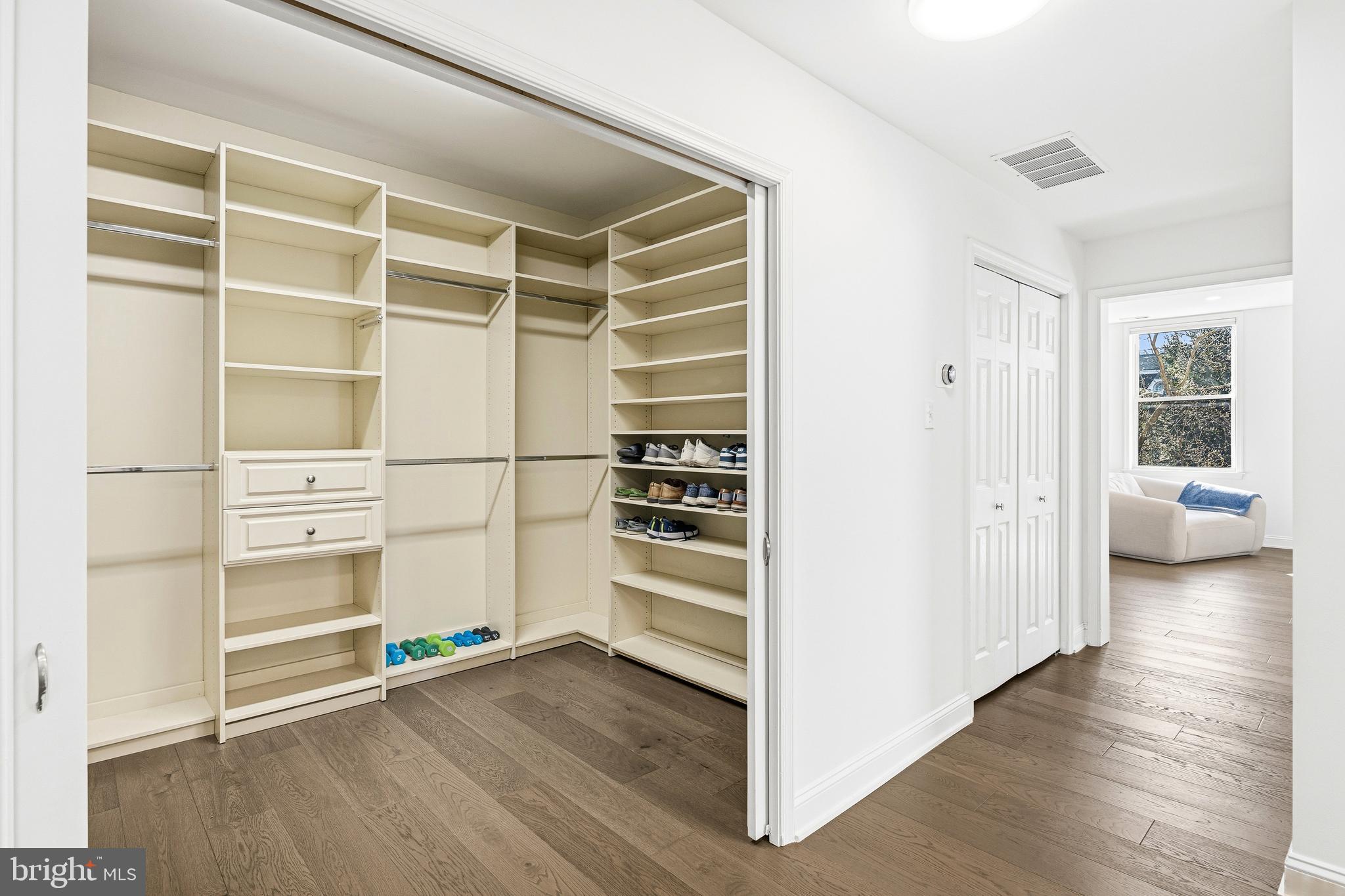 3313 Baring Street Philadelphia, PA 19104 - Photo 35 of 55 a view of an empty walk in closet and wooden floor