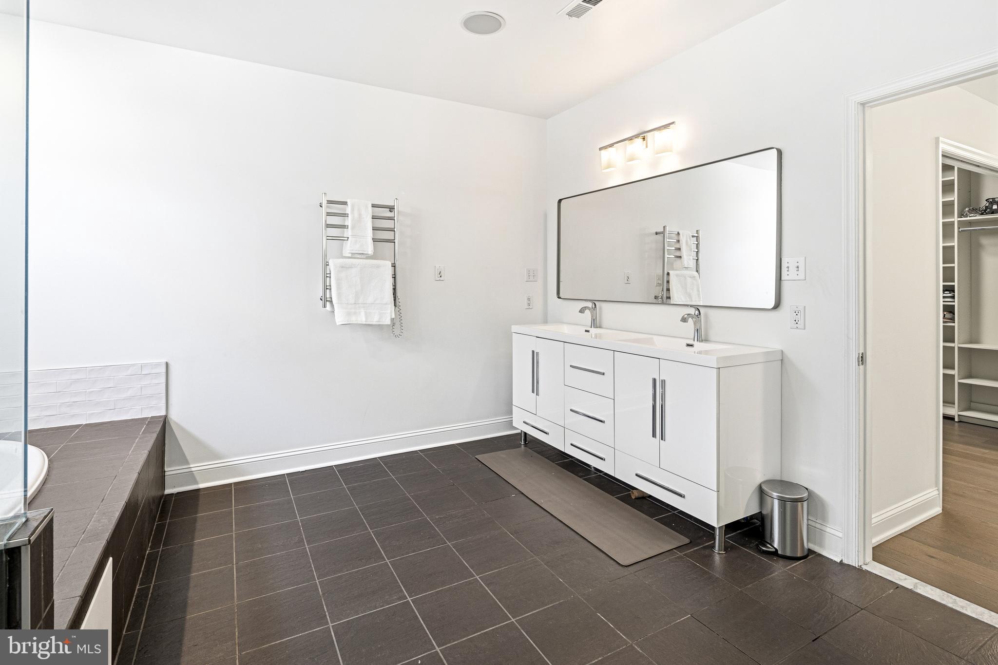 3313 Baring Street Philadelphia, PA 19104 - Photo 37 of 55 a bathroom with a sink a mirror and a shower