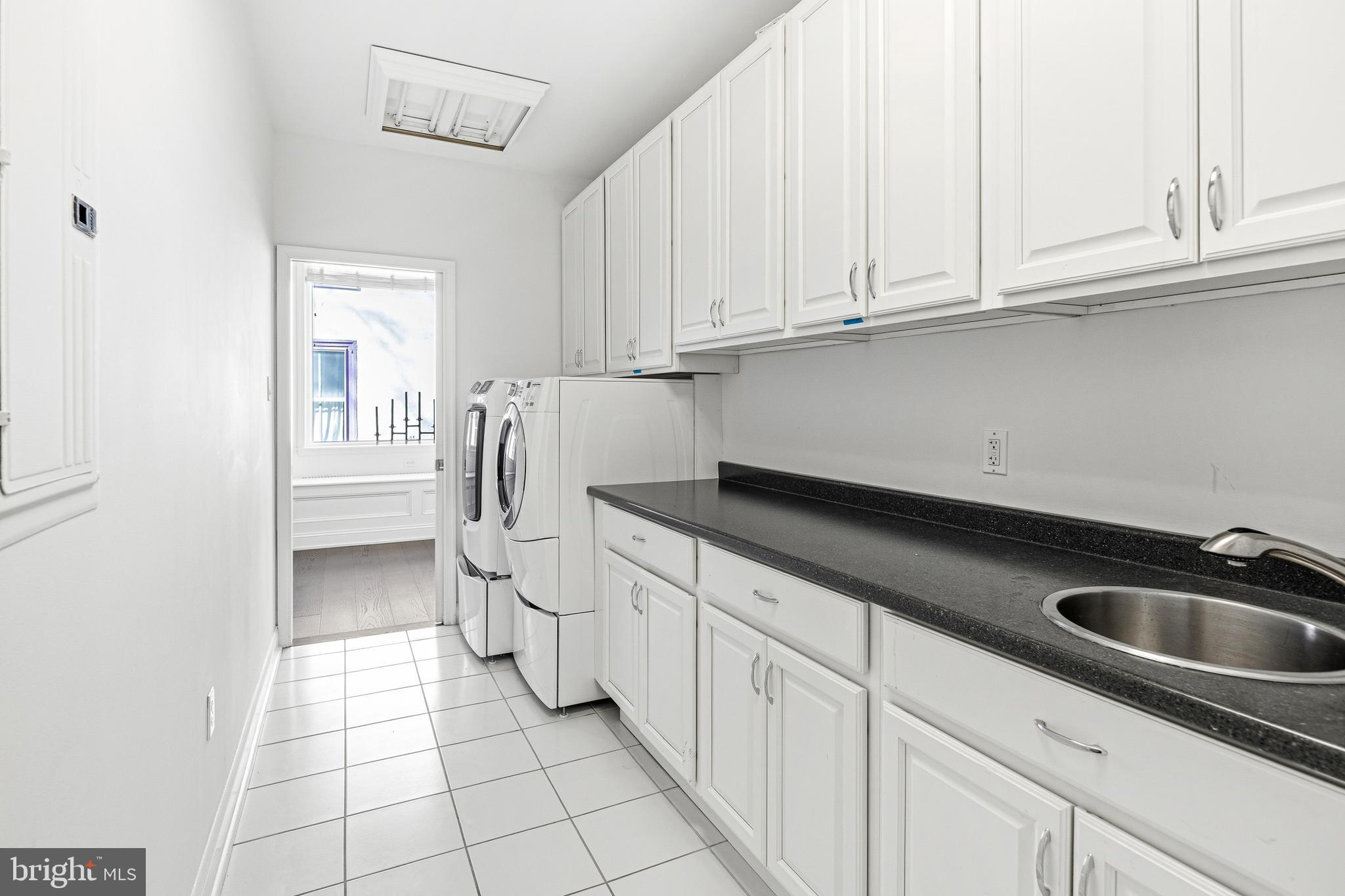 3313 Baring Street Philadelphia, PA 19104 - Photo 38 of 55 a kitchen with white cabinets and a sink