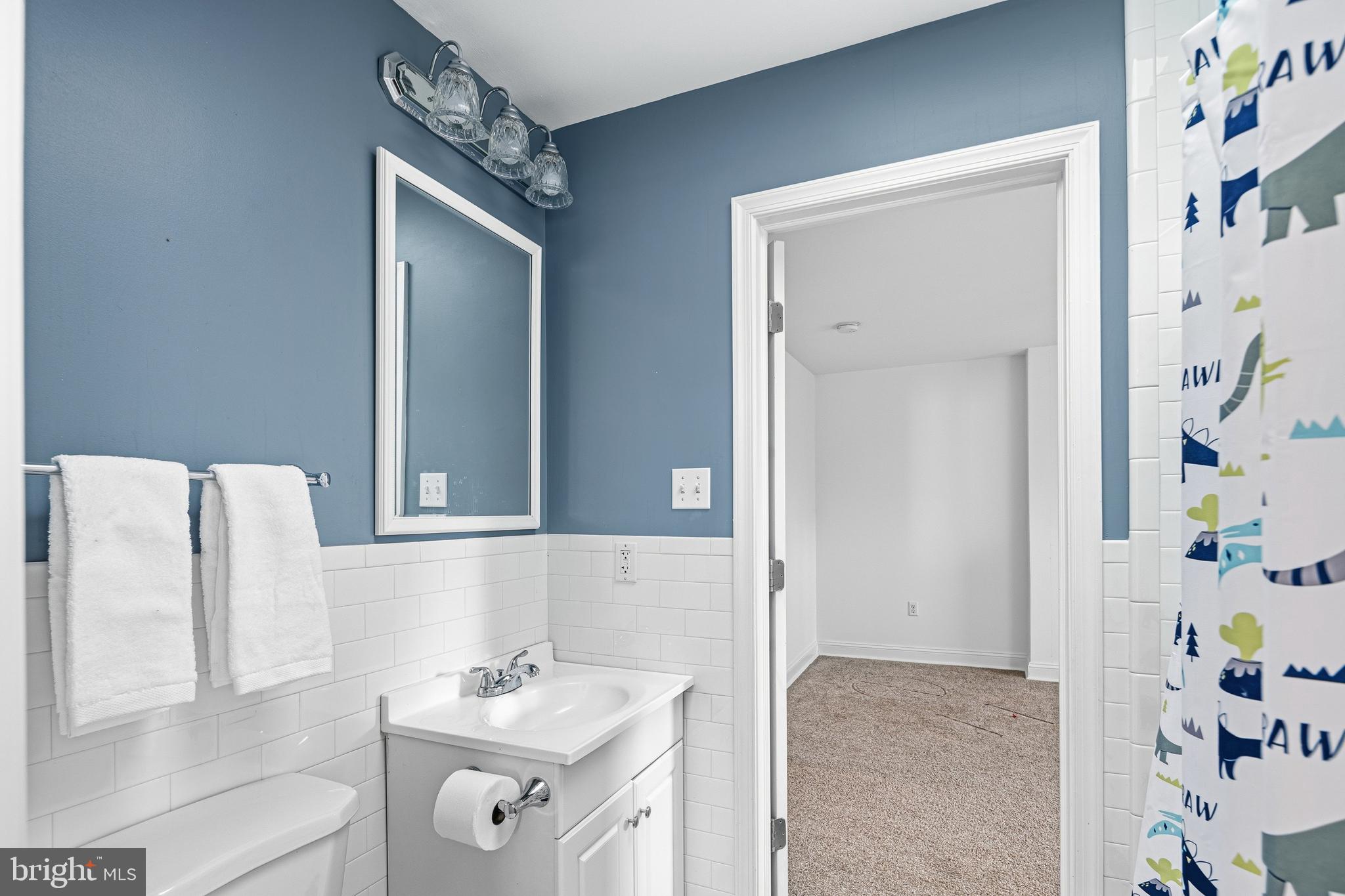3313 Baring Street Philadelphia, PA 19104 - Photo 46 of 55 a bathroom with a sink vanity and a mirror