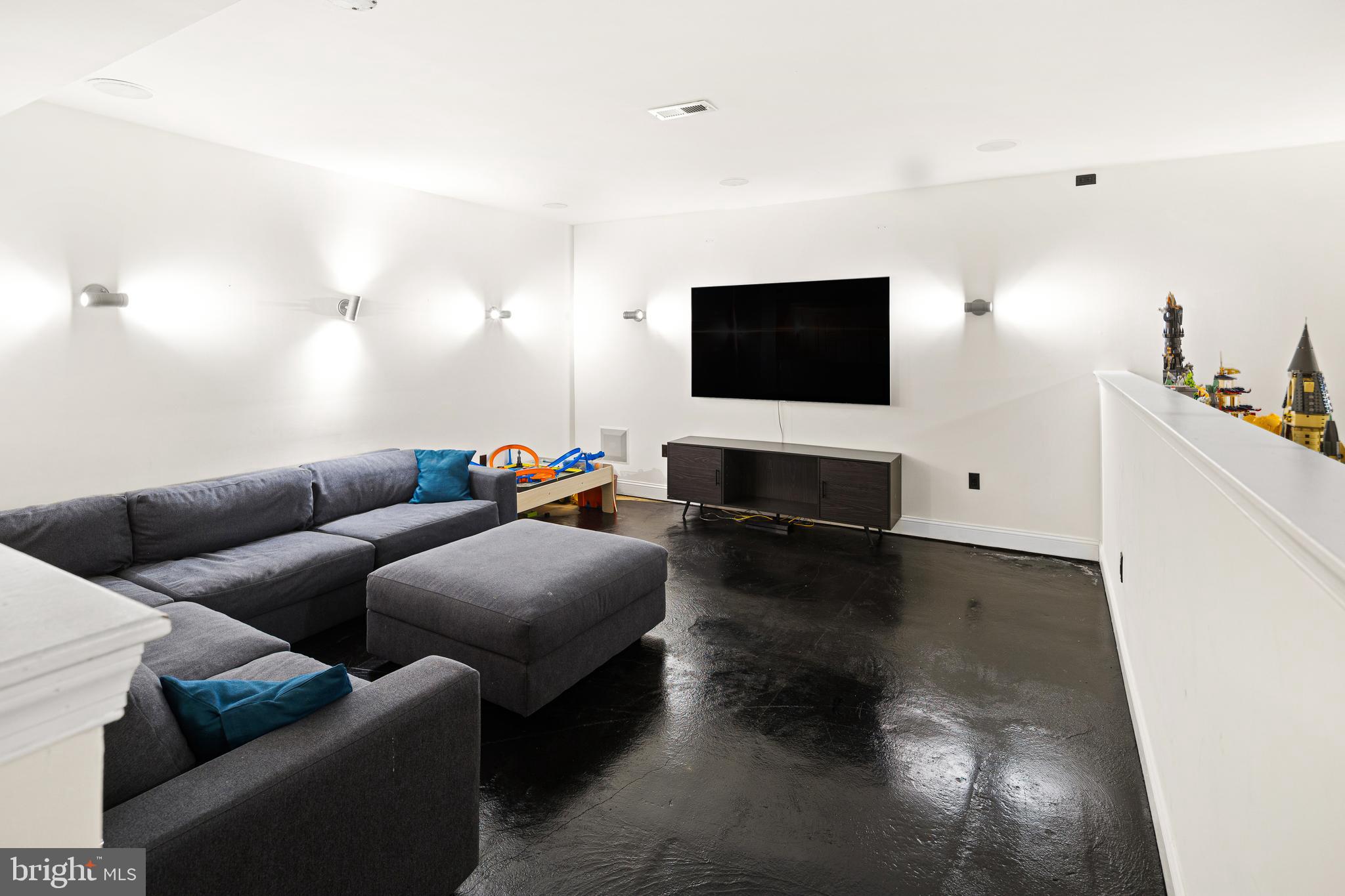 3313 Baring Street Philadelphia, PA 19104 - Photo 51 of 55 a living room with furniture and a flat screen tv