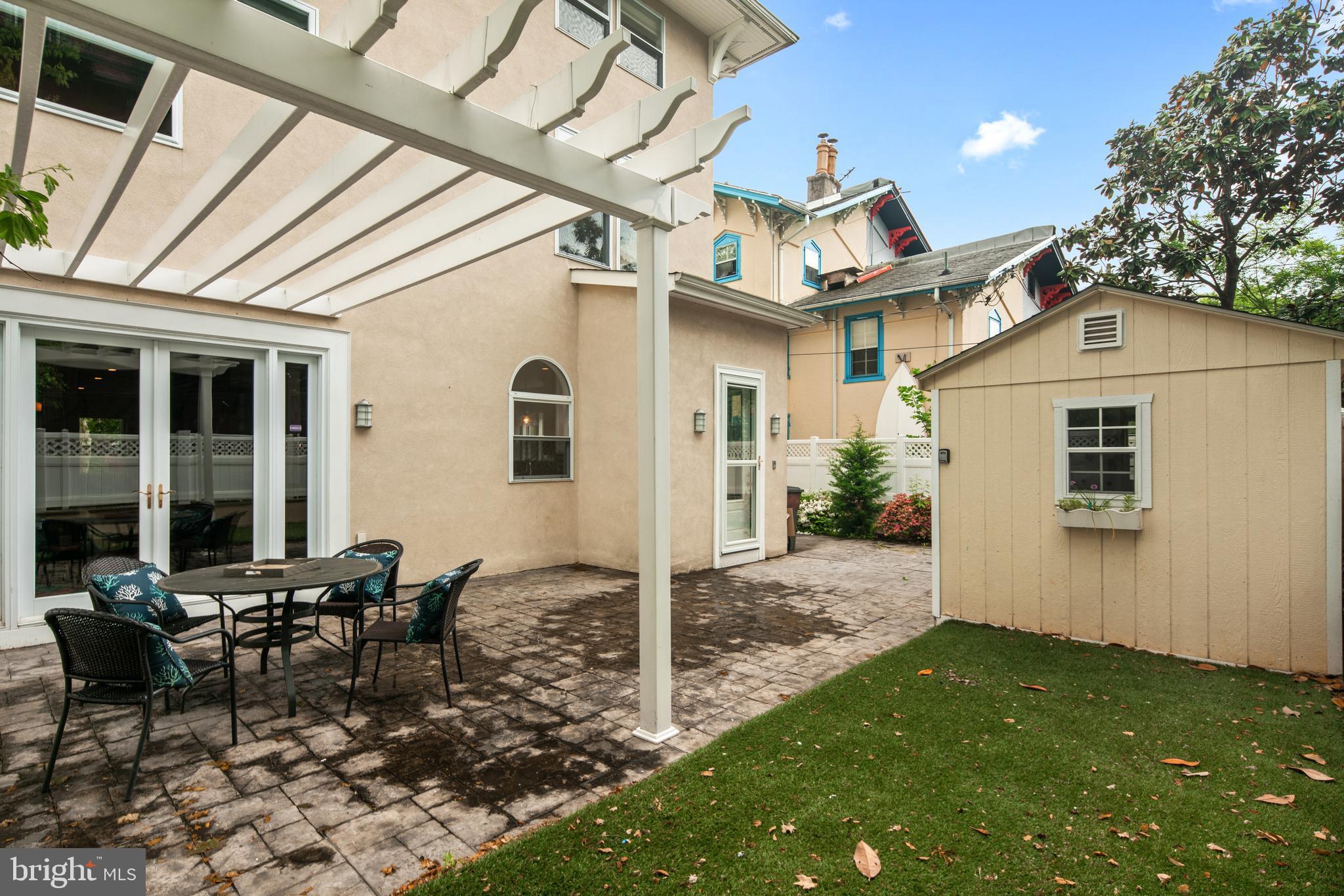 3313 Baring Street Philadelphia, PA 19104 - Photo 54 of 55 a view of a patio with table and chairs near a barbeque