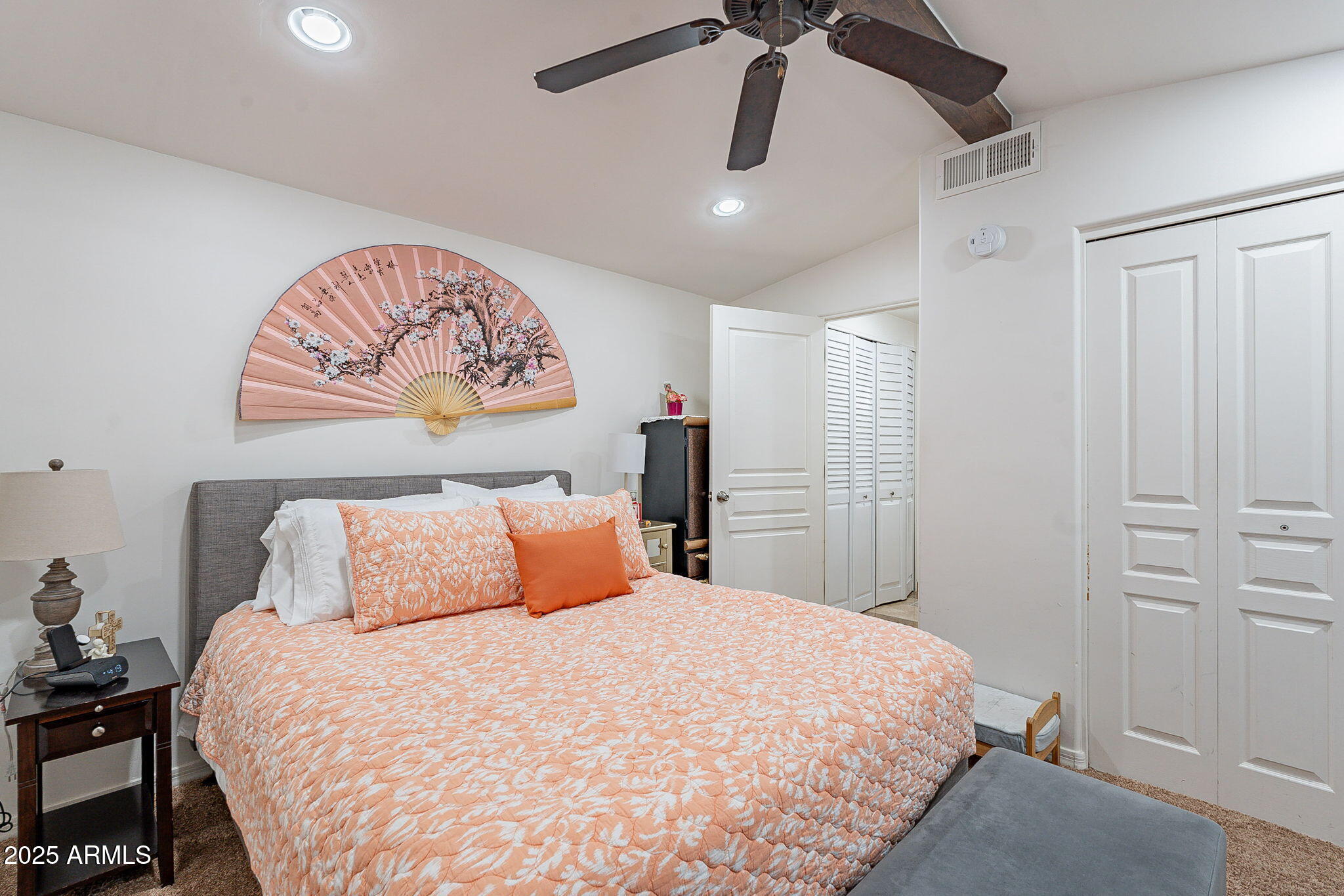 15606 South Gilbert Road, Unit 63 Chandler, AZ 85225 - Photo 14 of 21 a bedroom with a bed and a chandelier
