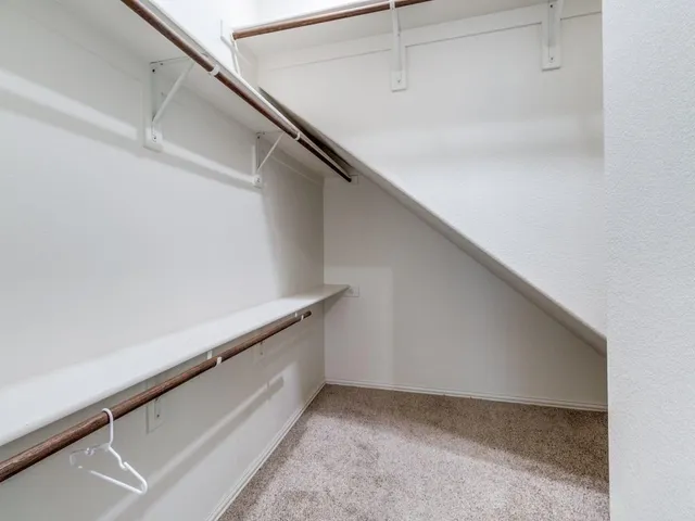 a view of an empty walk in closet