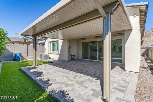 a view of an house with backyard porch and furniture