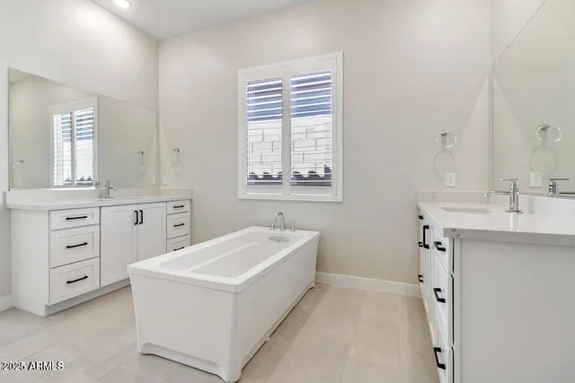 a bathroom with a sink a vanity and a mirror
