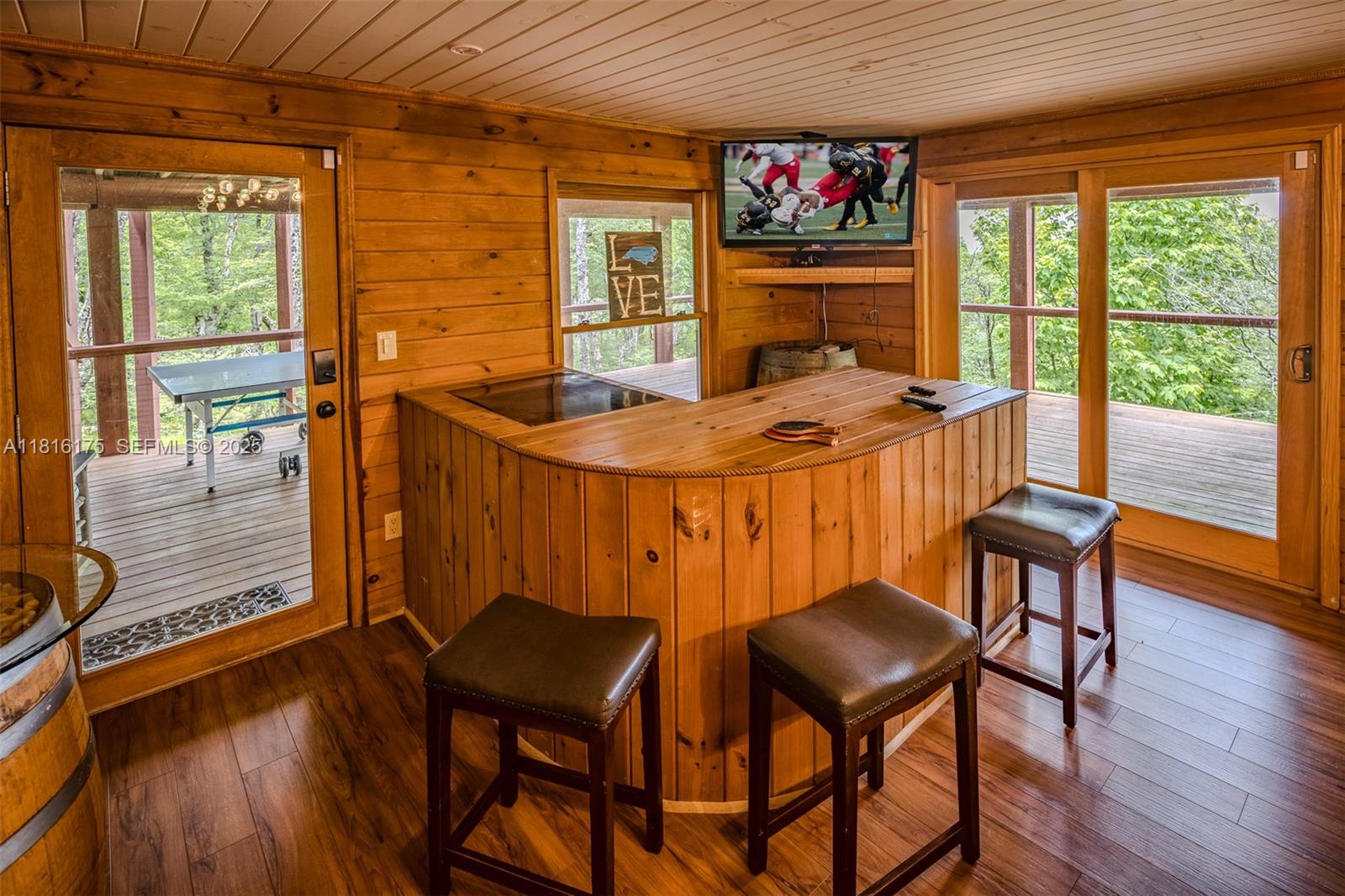 200 Summit Lodge Road Banner Elk, NC 28604 - Photo 27 of 51 a dining room with furniture and wooden floor