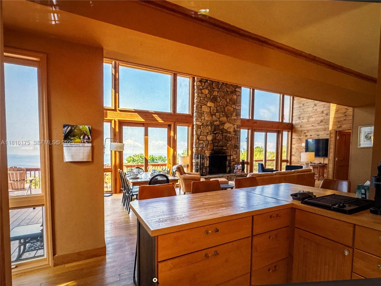 200 Summit Lodge Road Banner Elk, NC 28604 - Photo 9 of 51 a kitchen with a sink and a large window