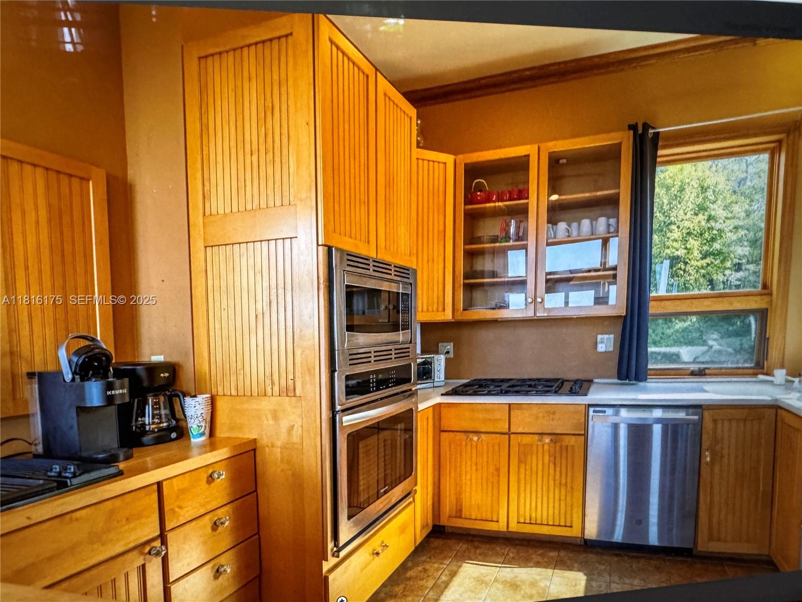 200 Summit Lodge Road Banner Elk, NC 28604 - Photo 10 of 51 a kitchen with granite countertop a stove and a refrigerator