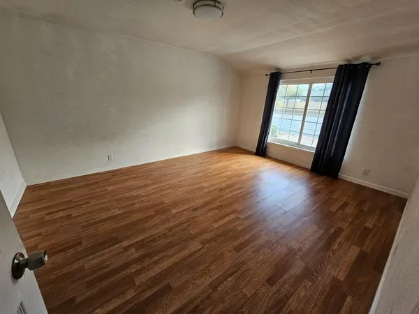 a view of an empty room and window