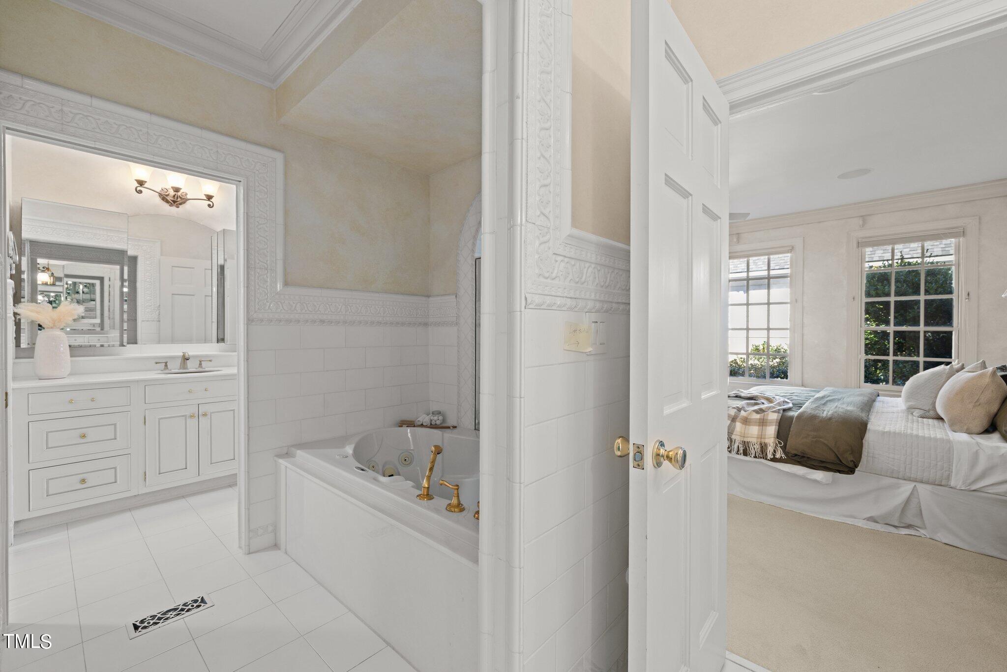 202 Villa Drive Durham, NC 27712 - Photo 13 of 53 a bathroom with a tub sink and mirror