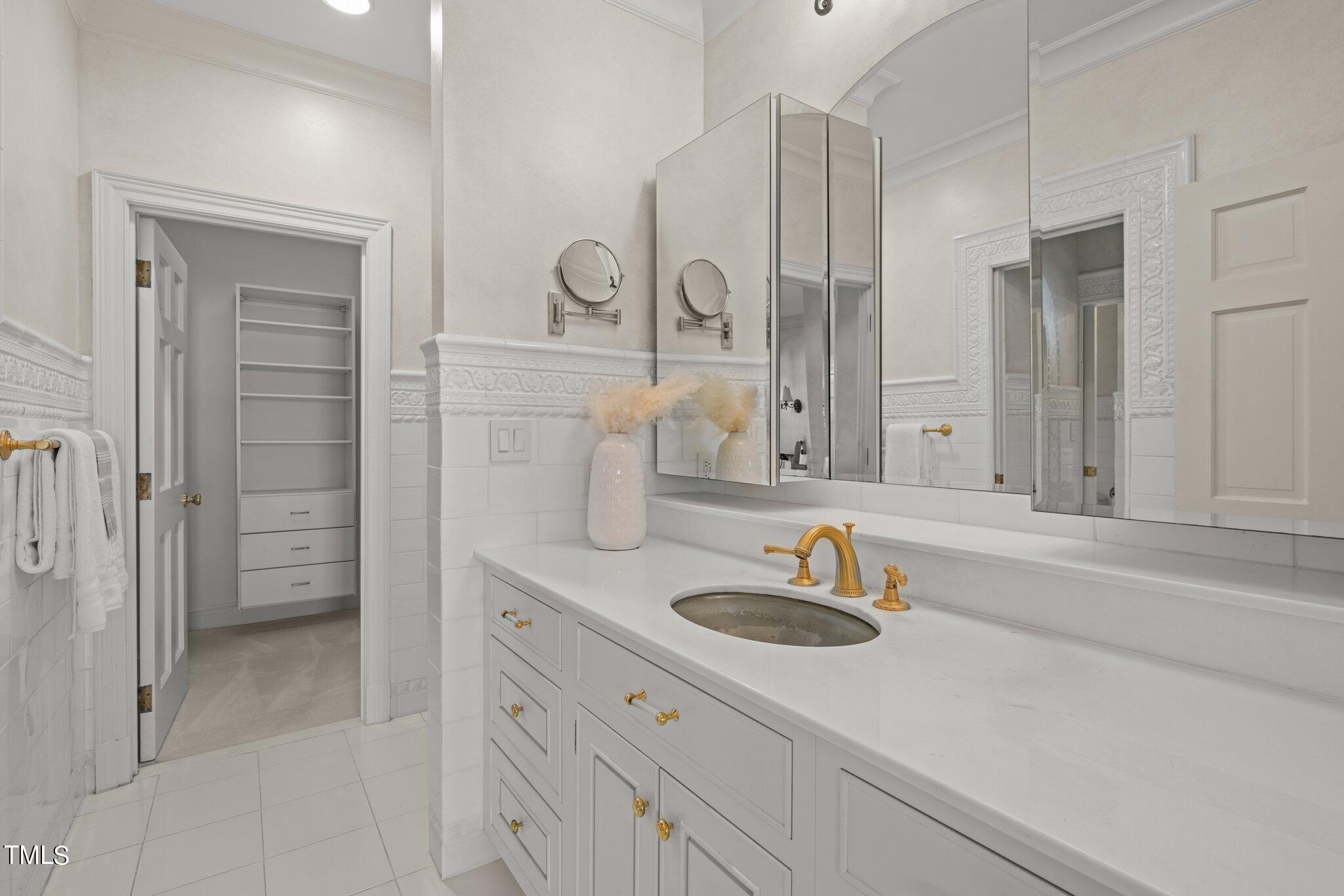 202 Villa Drive Durham, NC 27712 - Photo 17 of 53 a bathroom with a sink double vanity and a mirror