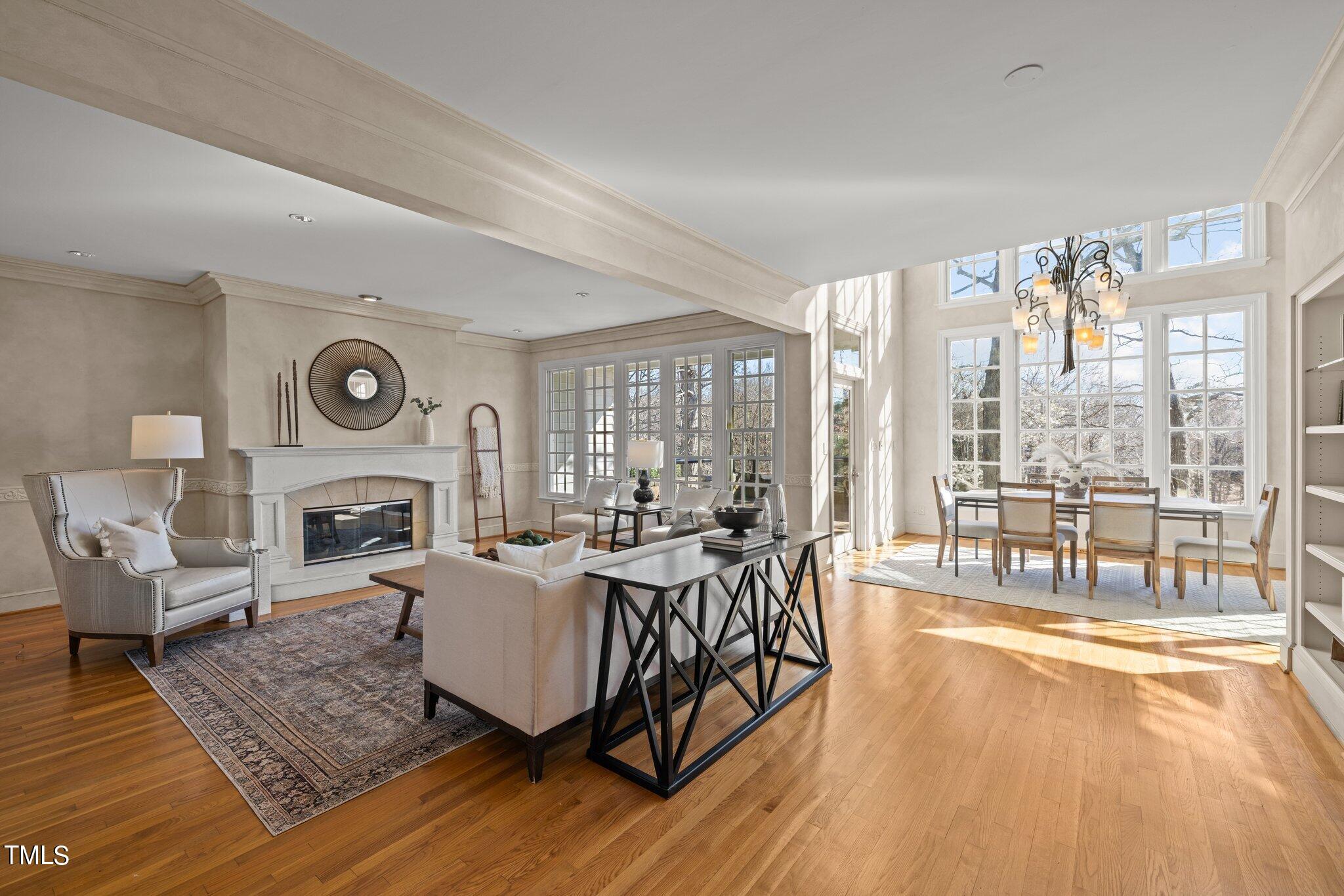 202 Villa Drive Durham, NC 27712 - Photo 20 of 53 a living room with fireplace furniture and floor to ceiling windows