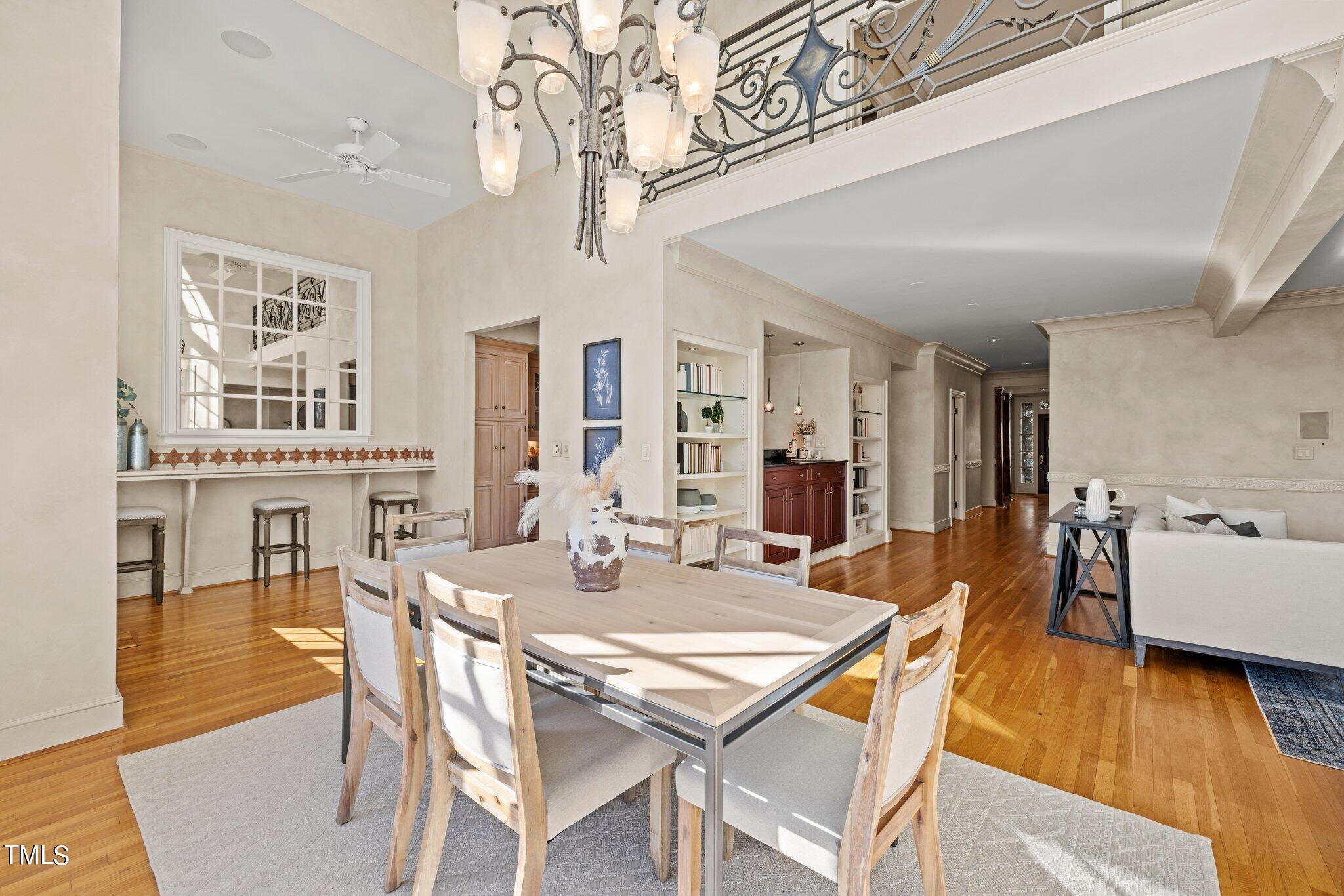 202 Villa Drive Durham, NC 27712 - Photo 26 of 53 a view of a dining room with furniture wooden floor and chandelier