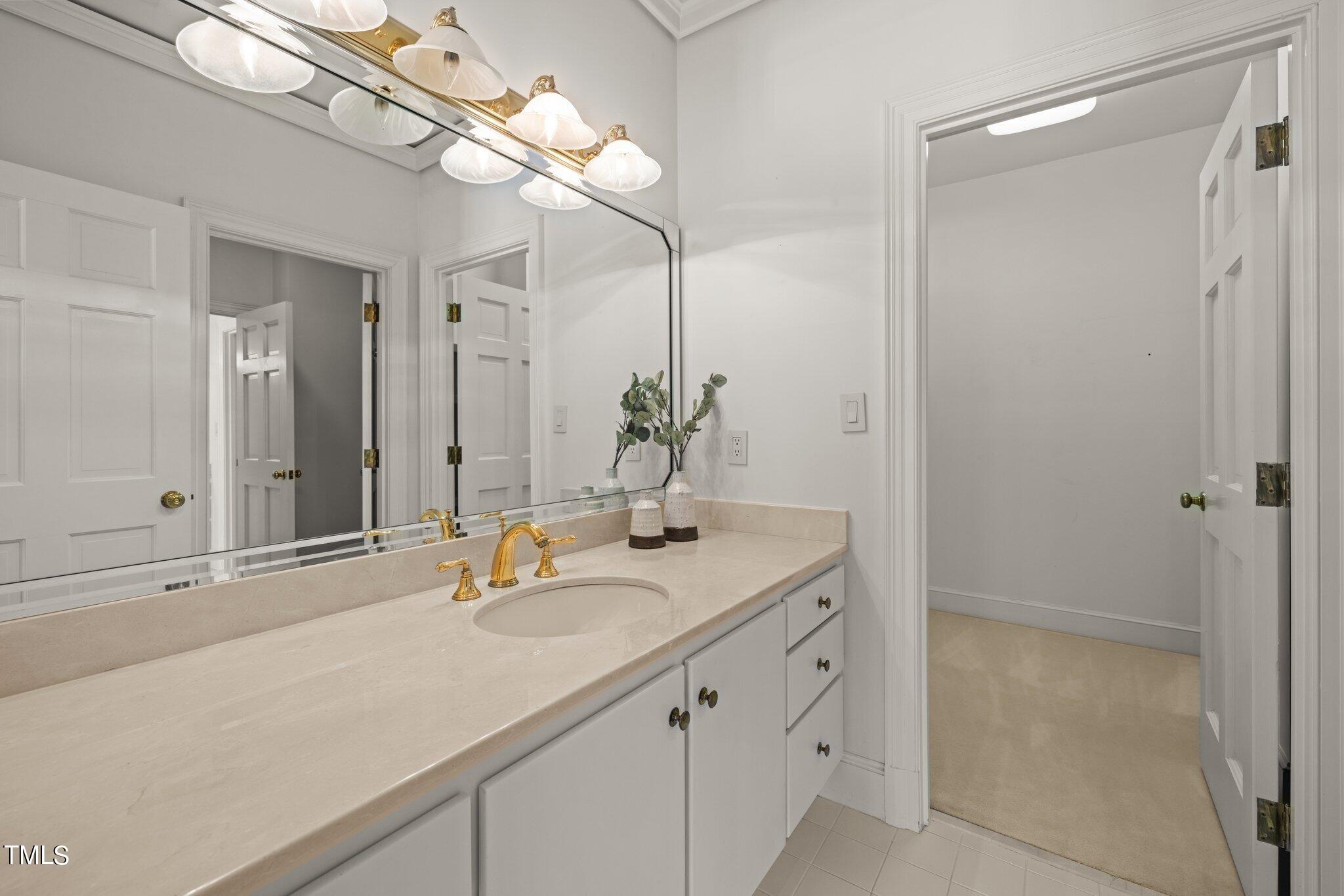 202 Villa Drive Durham, NC 27712 - Photo 38 of 53 a bathroom with a sink and a mirror