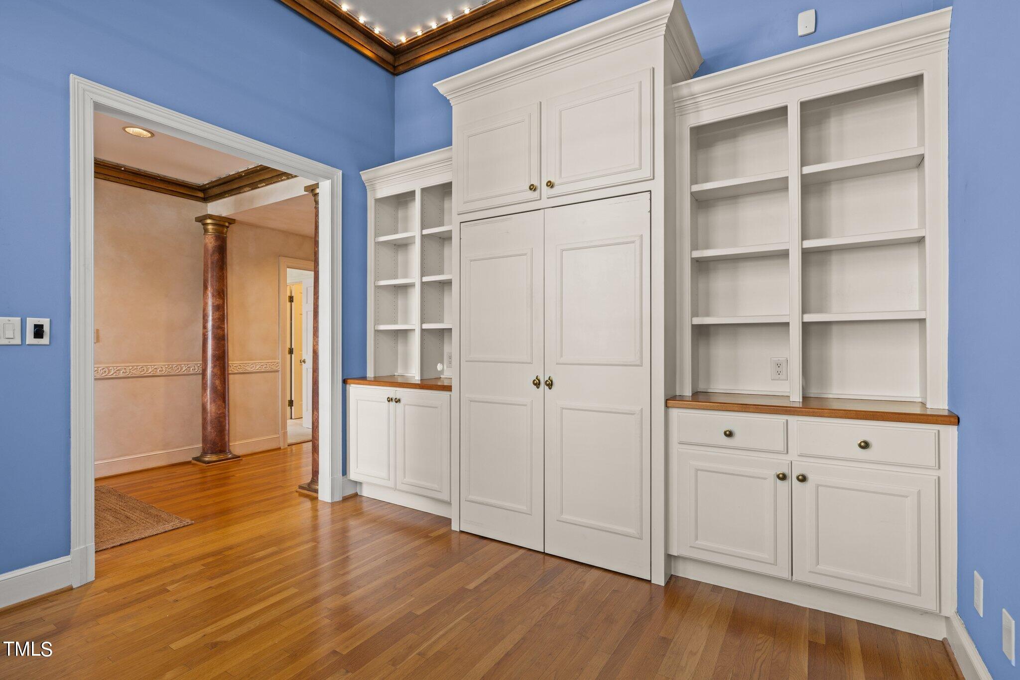 202 Villa Drive Durham, NC 27712 - Photo 8 of 53 a view of an empty room with wooden floor and closet