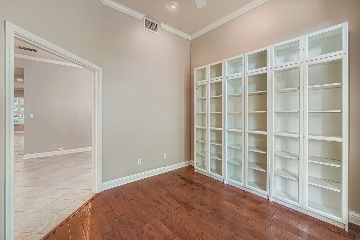 5000 Mission Oaks Boulevard, Unit 61 Austin, TX 78735 - Photo 10 of 27 Built in bookcase with glass front