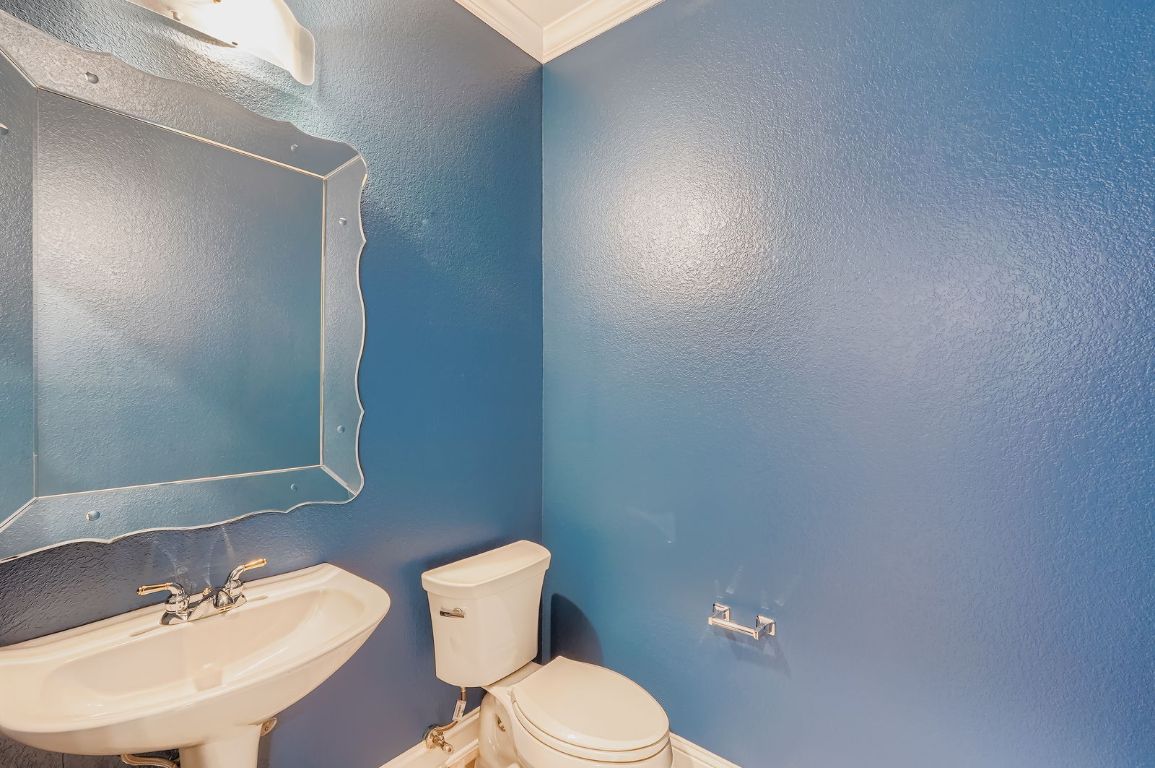 5000 Mission Oaks Boulevard, Unit 61 Austin, TX 78735 - Photo 11 of 27 Downstairs half bath with ornamental molding and a textured wall