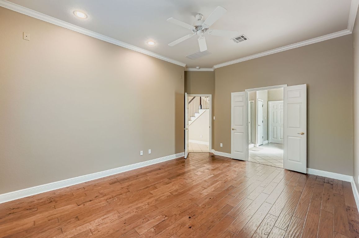 5000 Mission Oaks Boulevard, Unit 61 Austin, TX 78735 - Photo 12 of 27 Unfurnished bedroom featuring crown molding, light wood-style flooring, recessed lighting, and a ceiling fan