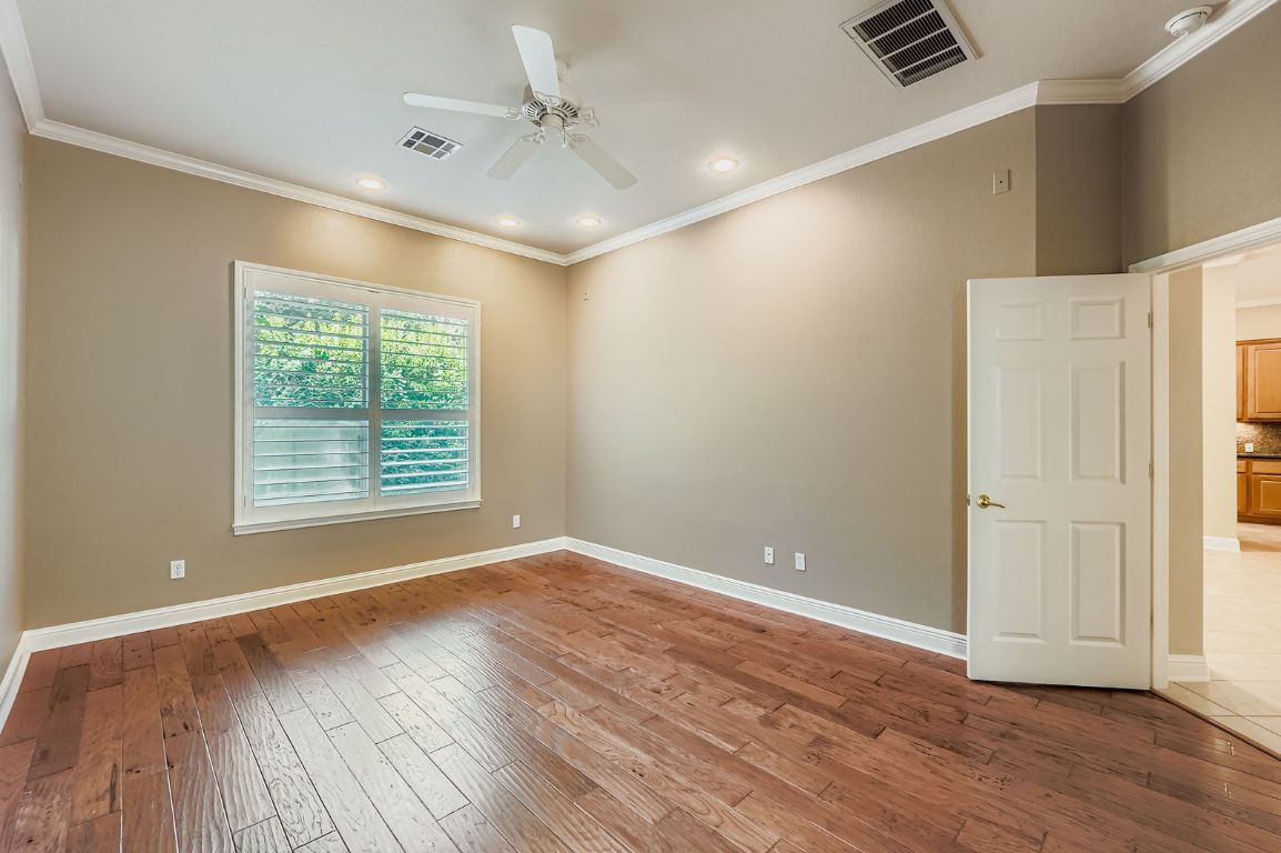 5000 Mission Oaks Boulevard, Unit 61 Austin, TX 78735 - Photo 14 of 27 Unfurnished room with crown molding, light wood-style floors, recessed lighting, and ceiling fan