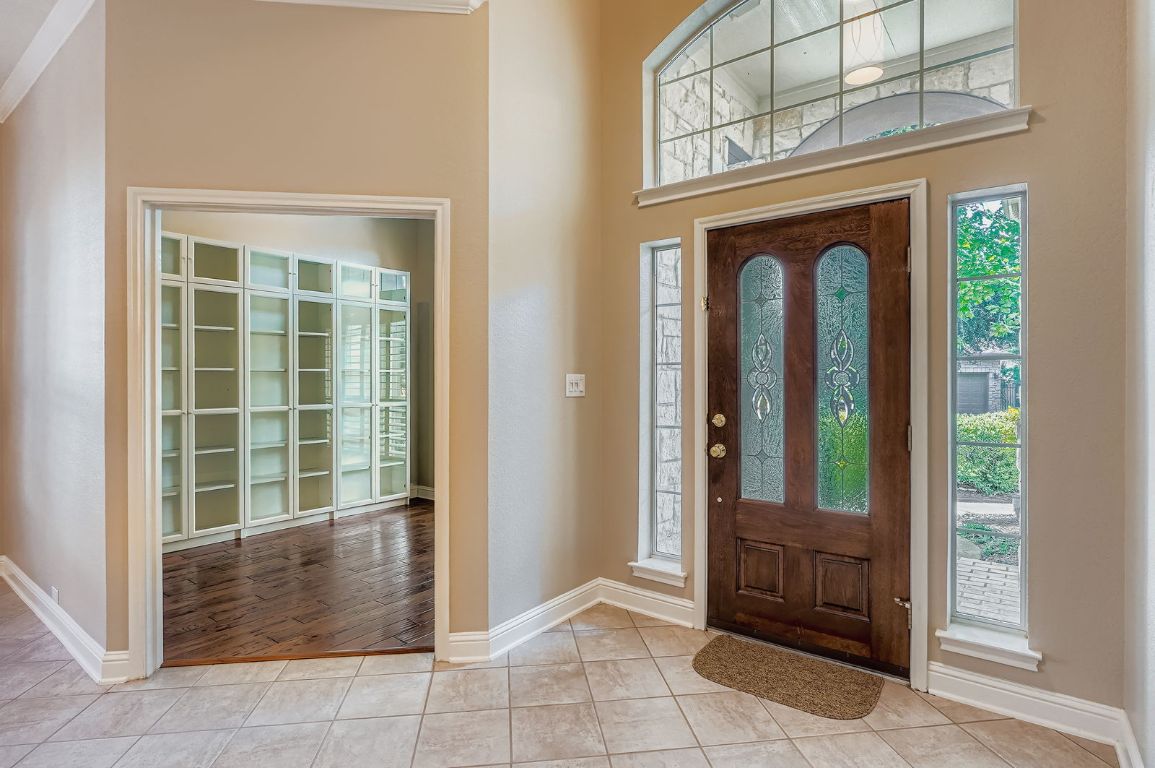 5000 Mission Oaks Boulevard, Unit 61 Austin, TX 78735 - Photo 2 of 27 Foyer with tile patterned floors and crown molding