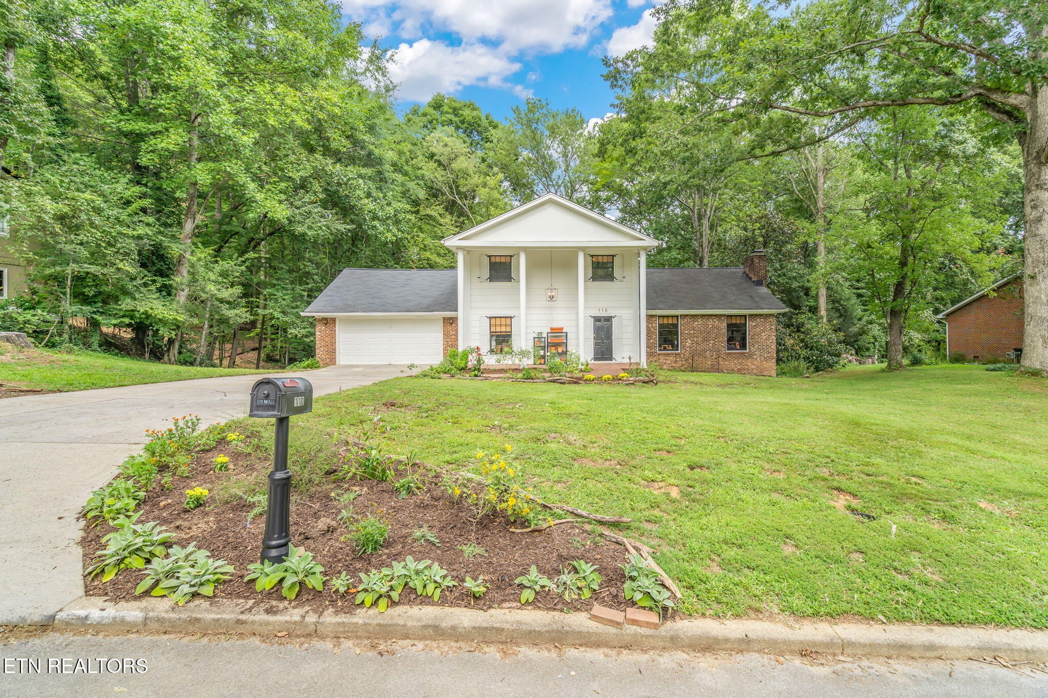 110 Balsam Road Oak Ridge, TN 37830 - Photo 4 of 39 a front view of a house with garden