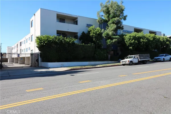 a view of street with parked cars