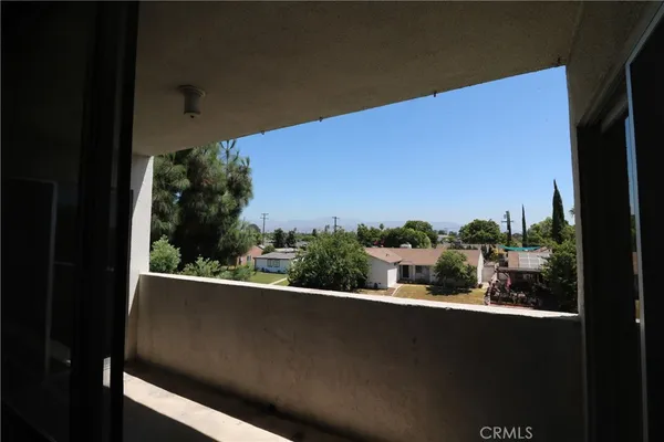a view of a street from a balcony
