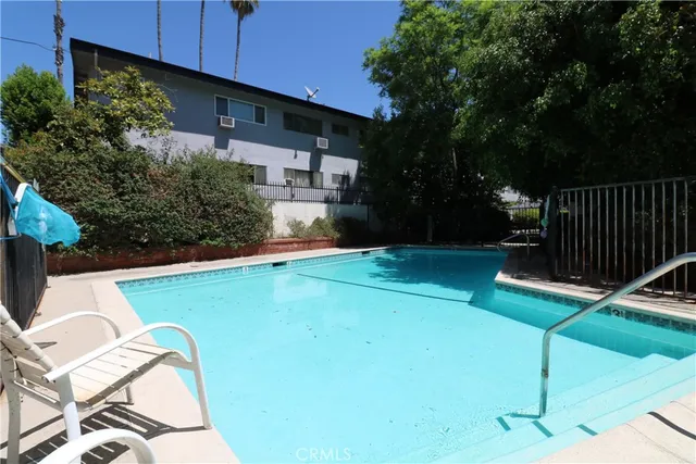 a view of a backyard with sitting area
