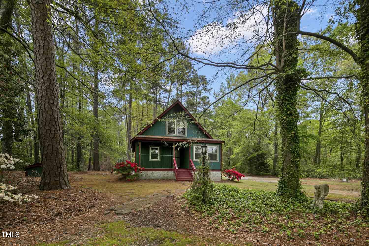 952 Glover Road Dunn, NC 28334 - Photo 1 of 31 a front view of a house with porch and garden