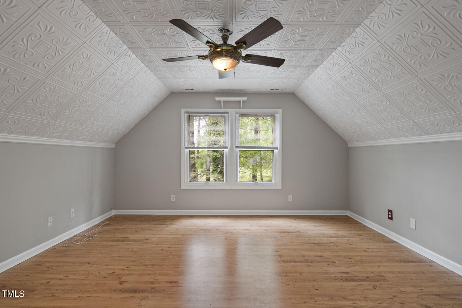 952 Glover Road Dunn, NC 28334 - Photo 21 of 31 an empty room with a window and a ceiling fan