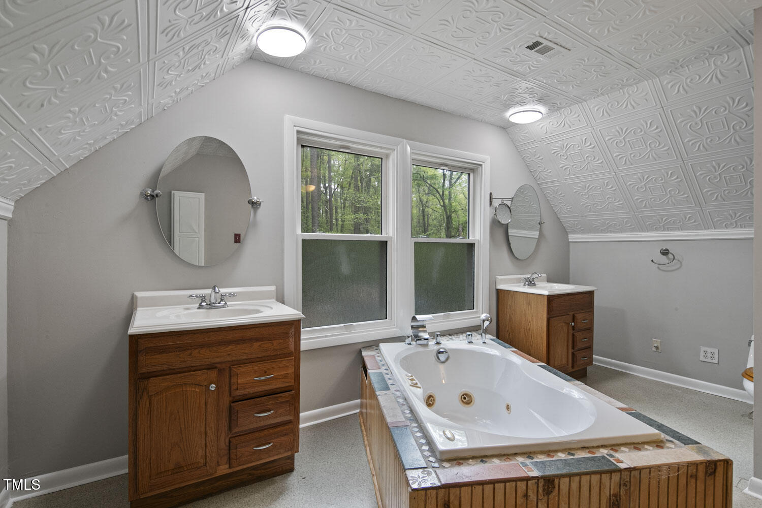 952 Glover Road Dunn, NC 28334 - Photo 24 of 31 a bathroom with a tub sink and mirror