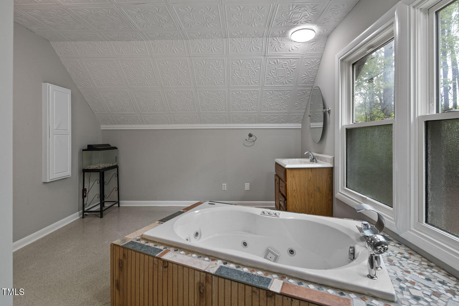 952 Glover Road Dunn, NC 28334 - Photo 25 of 31 a bathroom with a tub sink and a window
