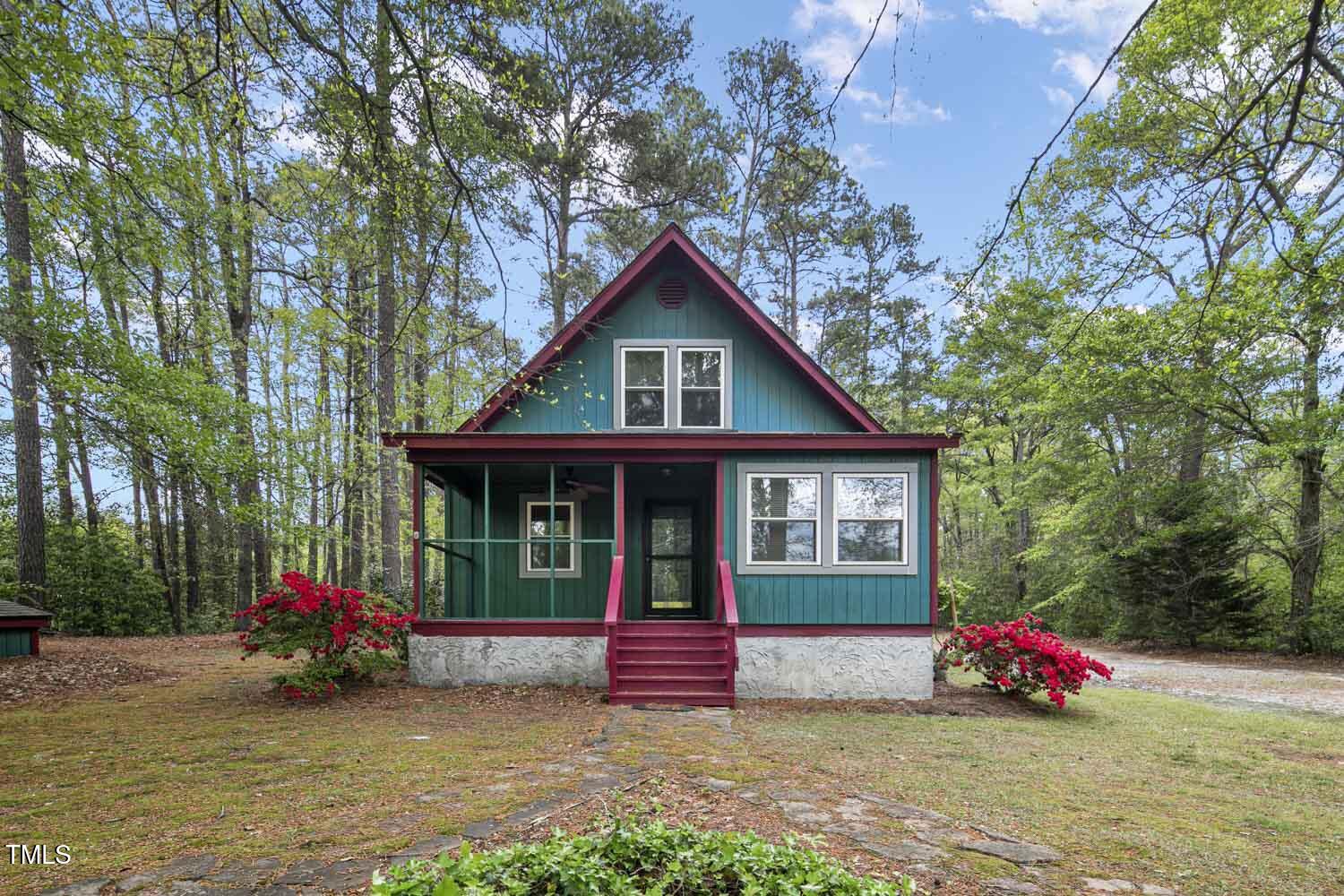 952 Glover Road Dunn, NC 28334 - Photo 6 of 31 a view of front house with an outdoor space