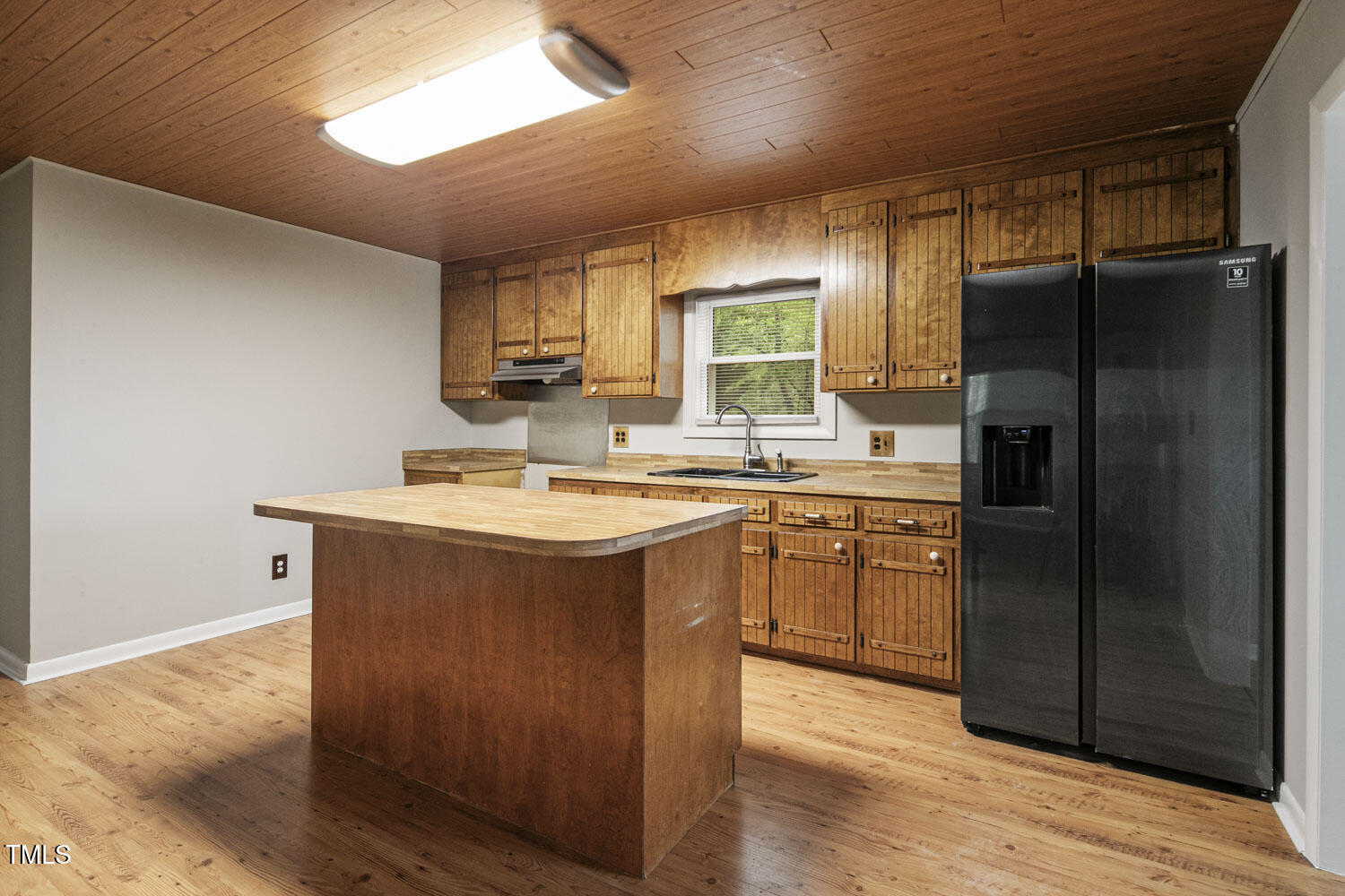 952 Glover Road Dunn, NC 28334 - Photo 10 of 31 a kitchen with stainless steel appliances granite countertop a refrigerator a sink and a stove