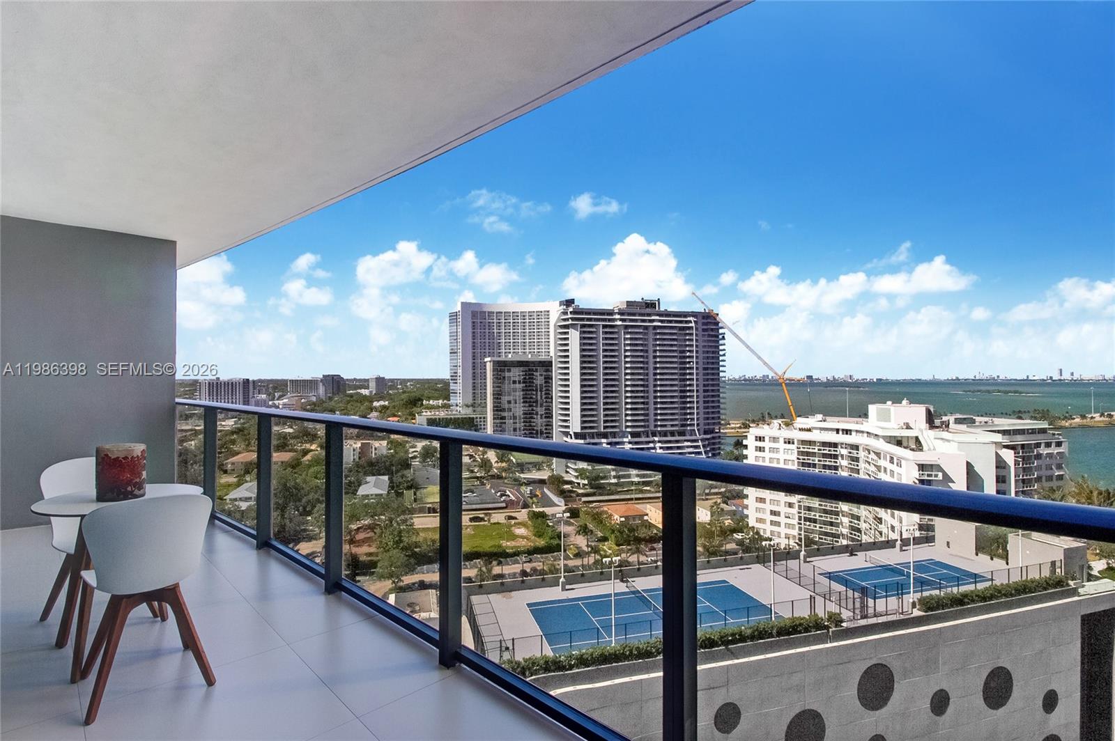 501 Northeast 31st Street, Unit 1502 Miami, FL 33137 - Photo 11 of 12 a view of a balcony with furniture