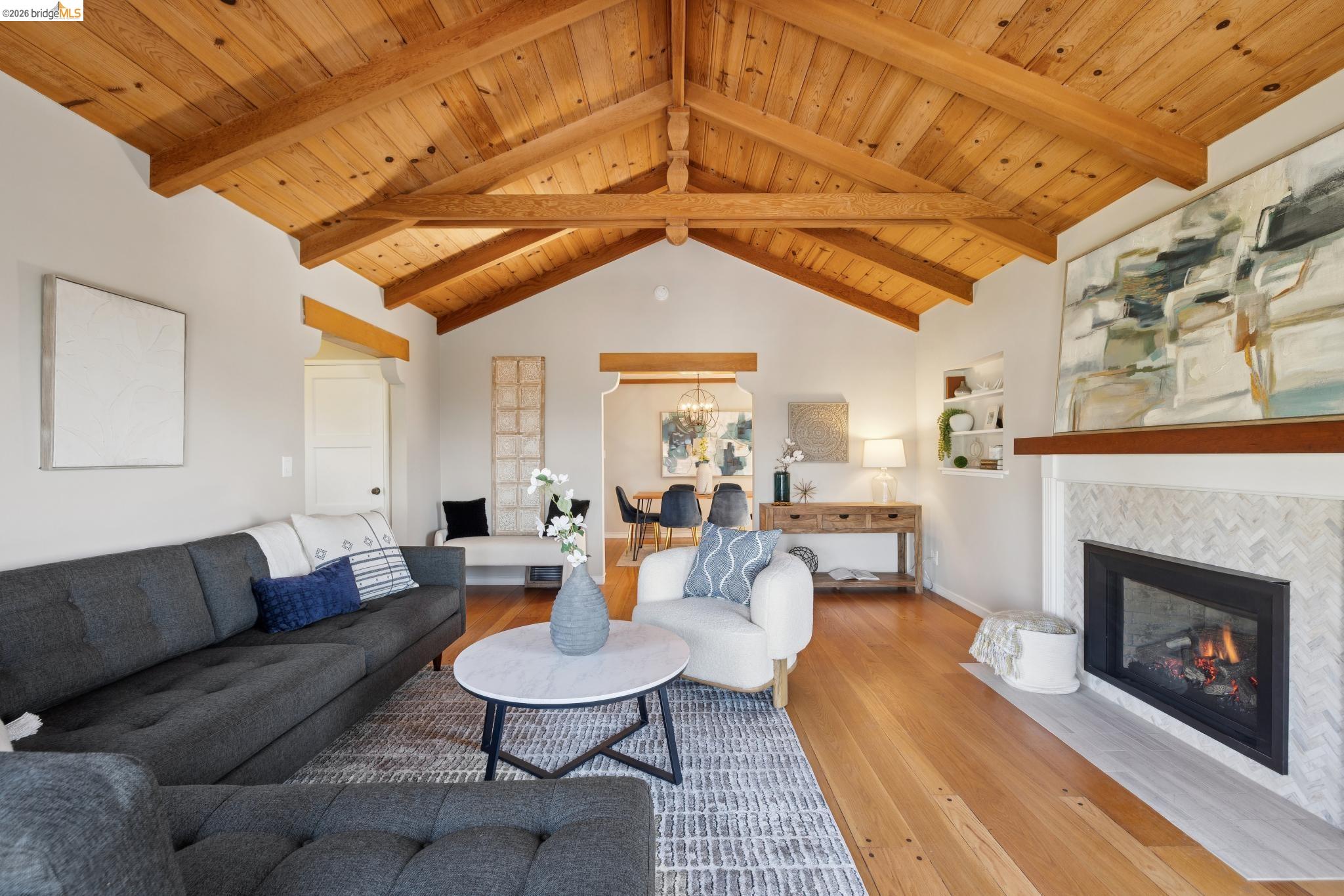 37 Kenyon Avenue Kensington, CA 94708 - Photo 11 of 60 a living room with furniture a fireplace and a table