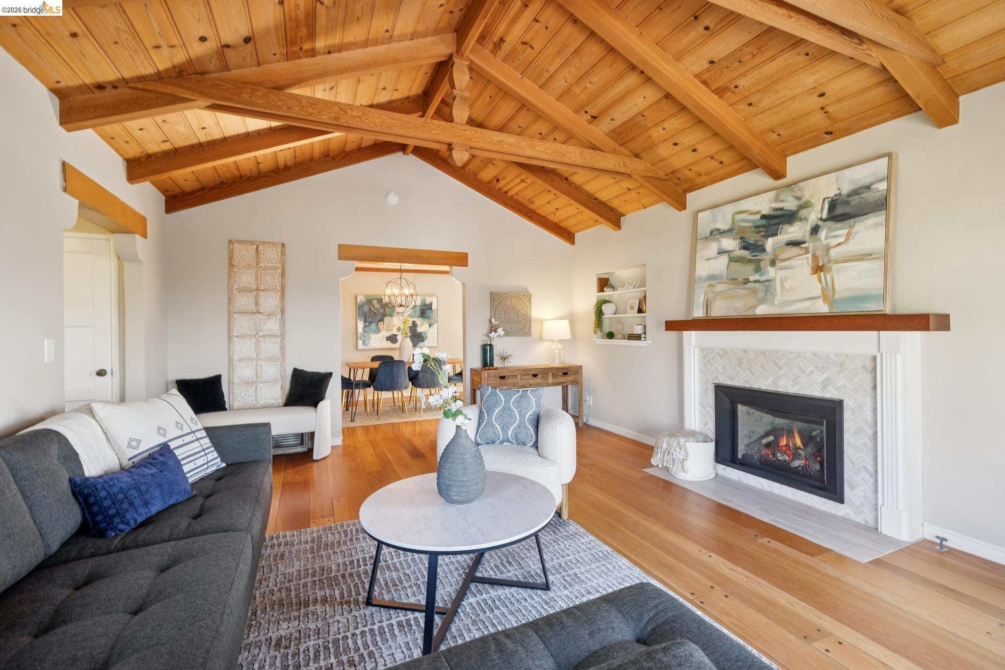 37 Kenyon Avenue Kensington, CA 94708 - Photo 12 of 60 a living room with furniture and a fireplace