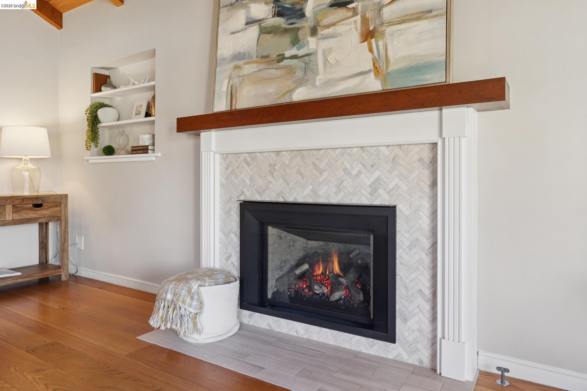 37 Kenyon Avenue Kensington, CA 94708 - Photo 13 of 60 a living room with a fireplace and a wooden floor