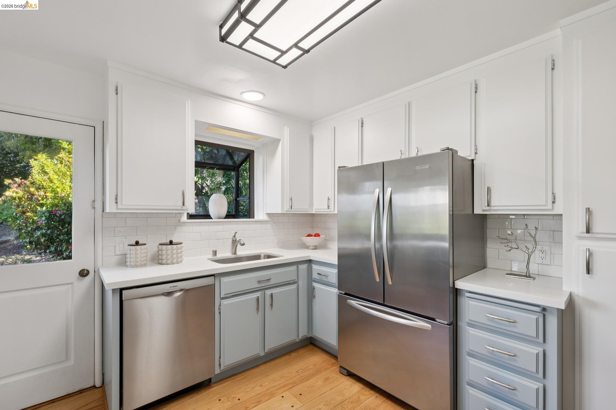 37 Kenyon Avenue Kensington, CA 94708 - Photo 19 of 60 a kitchen with stainless steel appliances a refrigerator sink and cabinets