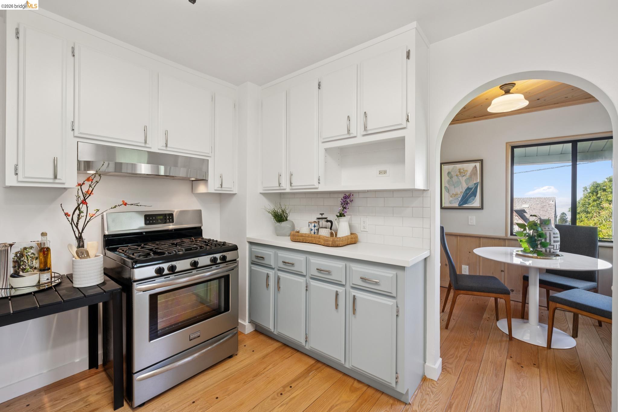 37 Kenyon Avenue Kensington, CA 94708 - Photo 20 of 60 a kitchen with white cabinets and appliances