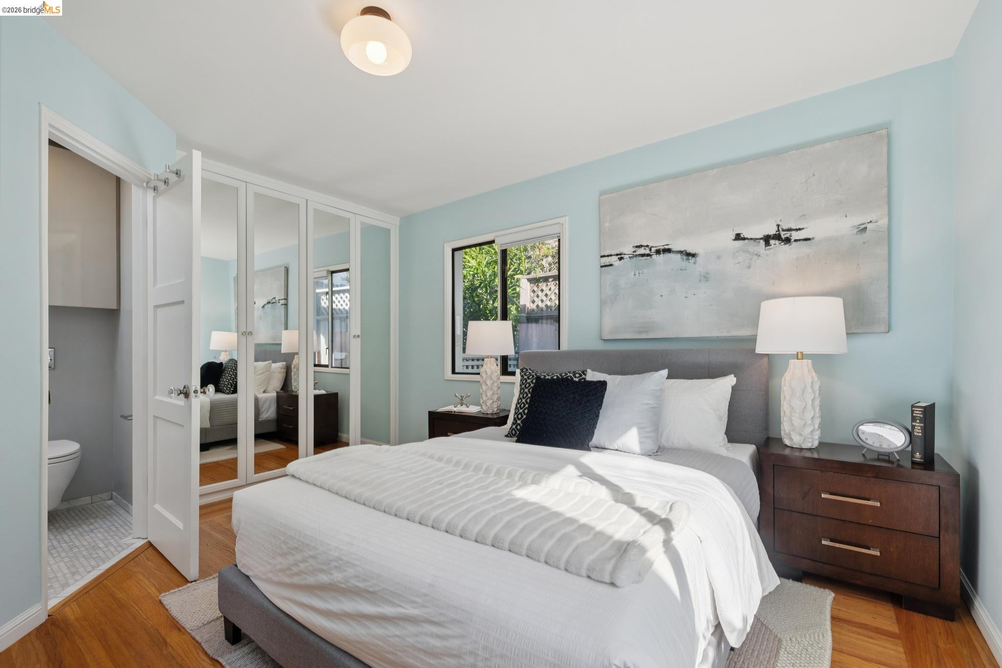 37 Kenyon Avenue Kensington, CA 94708 - Photo 26 of 60 a bedroom with a bed and a lamp on table