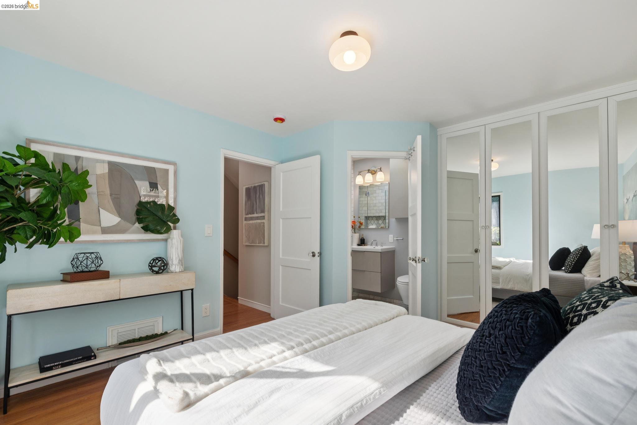 37 Kenyon Avenue Kensington, CA 94708 - Photo 27 of 60 a bedroom with a bed and a potted plant