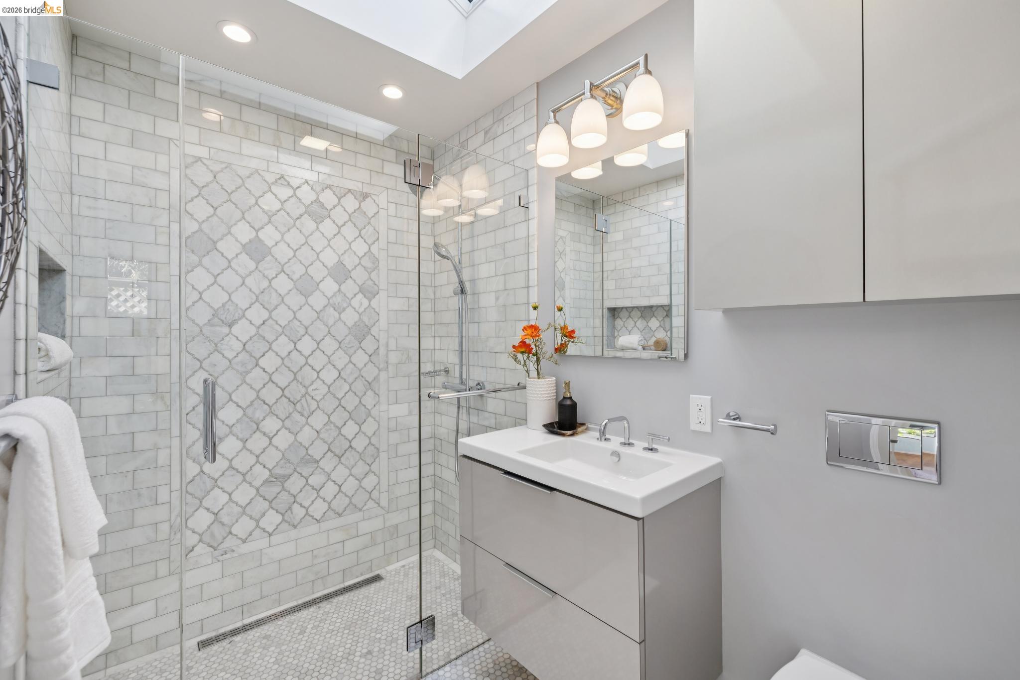 37 Kenyon Avenue Kensington, CA 94708 - Photo 28 of 60 a bathroom with a sink vanity and a mirror