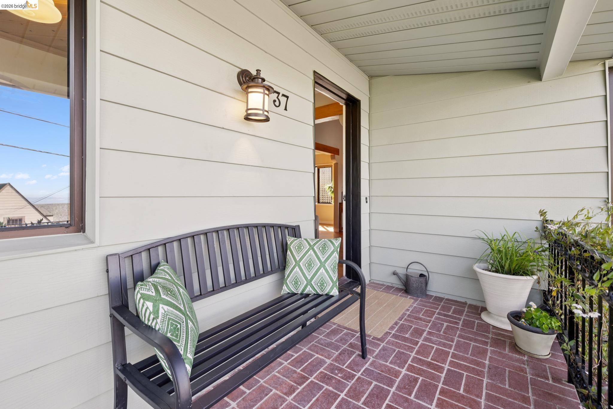 37 Kenyon Avenue Kensington, CA 94708 - Photo 3 of 60 a view of a bench in back yard of a house