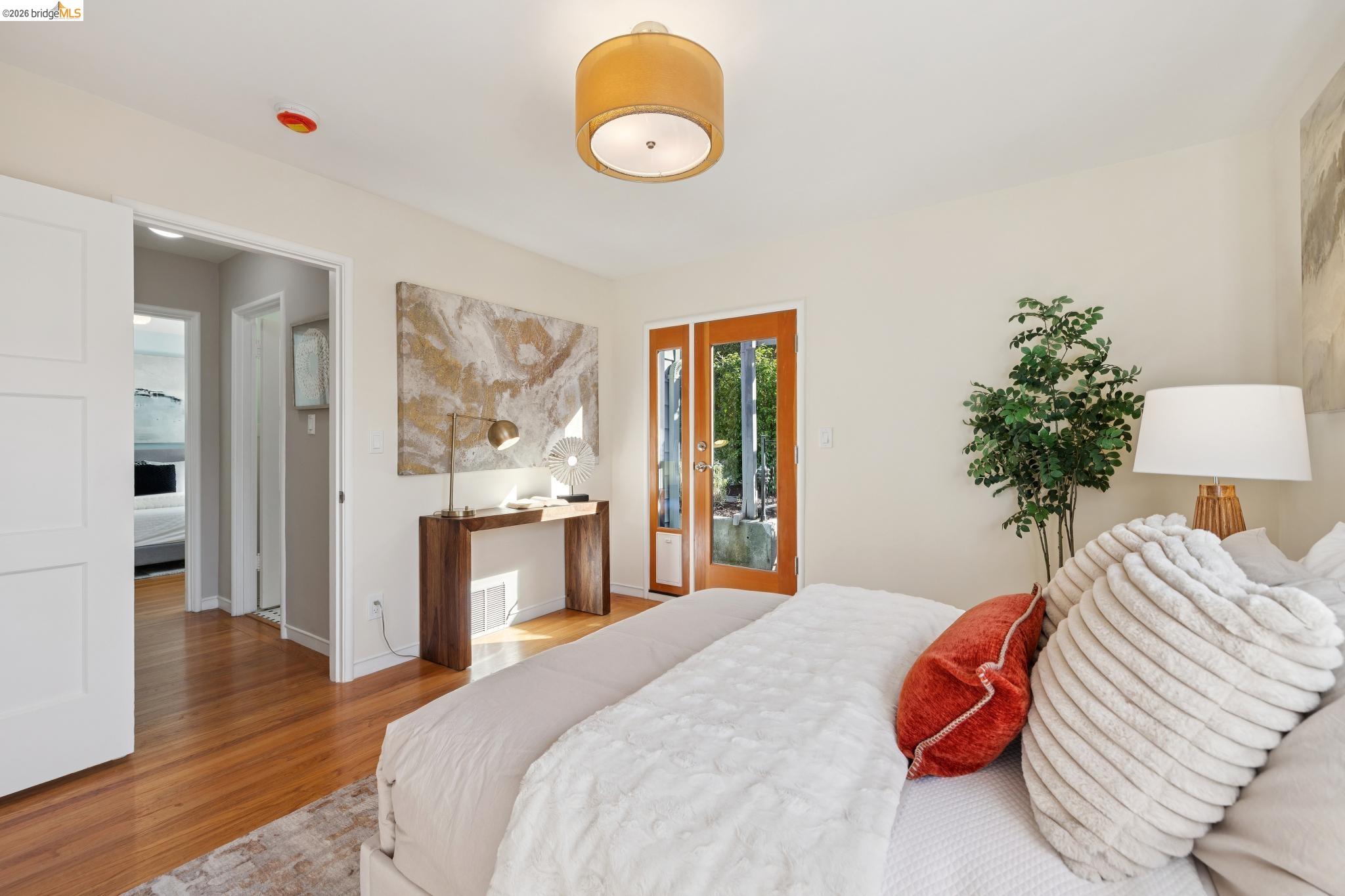 37 Kenyon Avenue Kensington, CA 94708 - Photo 33 of 60 a bedroom with a bed and a potted plant