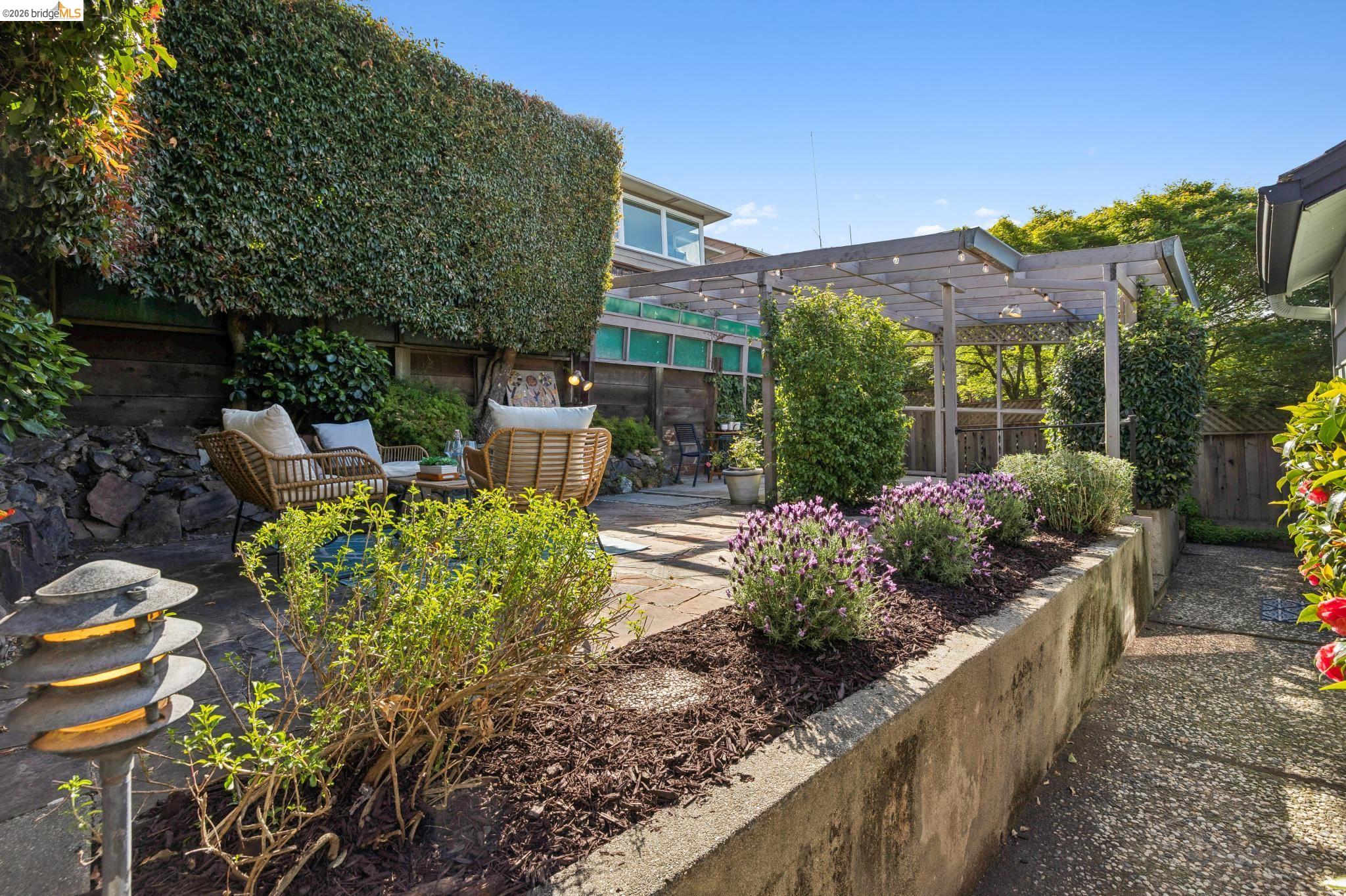 37 Kenyon Avenue Kensington, CA 94708 - Photo 44 of 60 a view of a chairs and table in the backyard