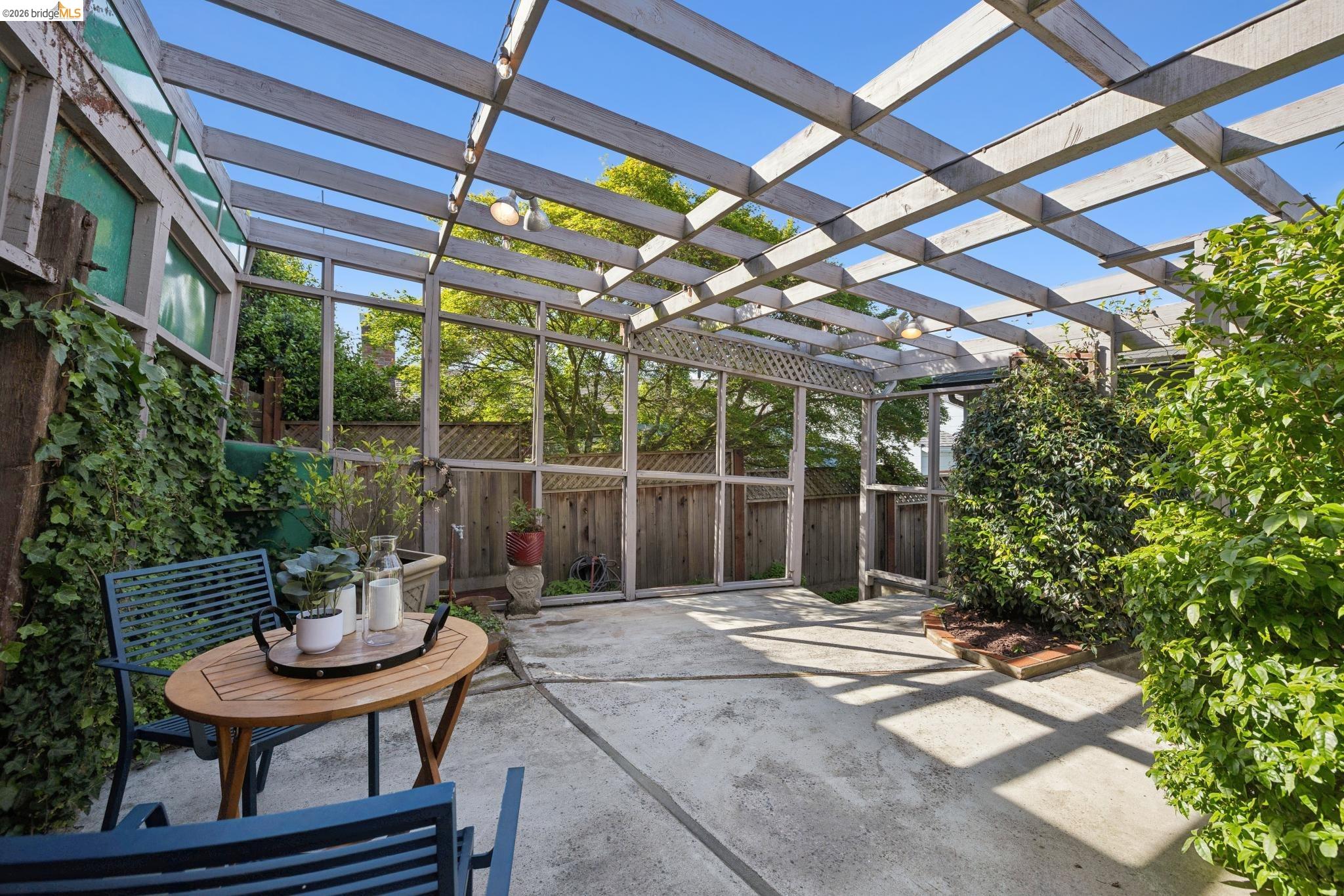 37 Kenyon Avenue Kensington, CA 94708 - Photo 49 of 60 a backyard of a house with fountain table and chairs
